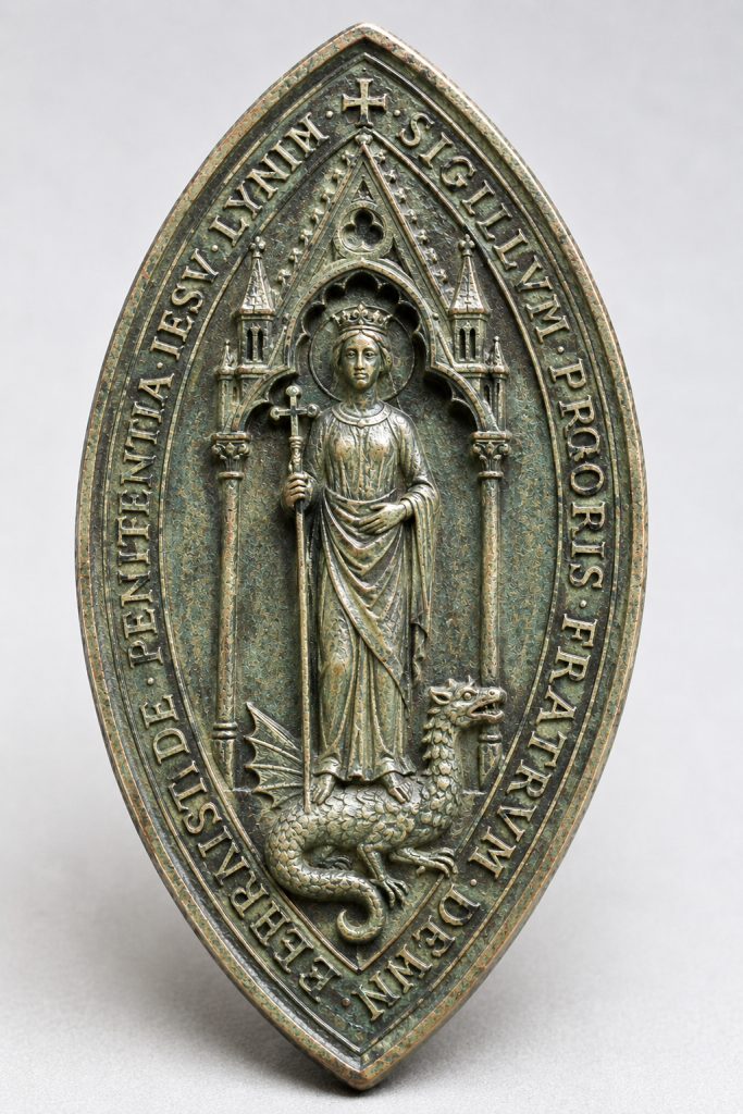 
The clearest physical survival of the Sack Friars is a copper-alloy seal matrix. It is pointed oval, 39 by 24 millimetres, and shows St Margaret of Antioch beneath a church-like canopy. She holds a cross-staff and stands on a dragon. The inscription identifies it as the seal of the prior of the Brothers of the Penitence of Jesus Christ of Lynn (Friars of the Sack). 
AI generated image