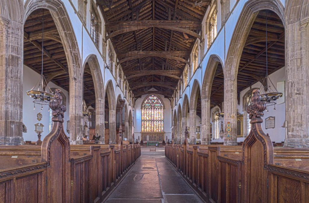  The great interior of St Nicholas’ Chapel, King’s Lynn, looking east beneath the medieval timber roof. The present open view owes much to Victorian clearance, but the scale belongs to Lynn’s late medieval prosperity.
Source: https://www.visitwestnorfolk.com/